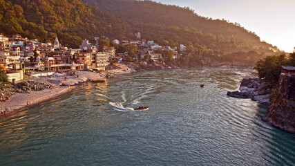 Rishikesh, Uttarakhand/India - November 17, 2013: People enjoying steamer boat ride and river...