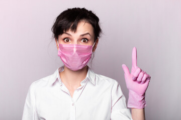 girl in a white shirt, pink medical mask and gloves