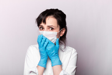 girl in a white shirt, a medical mask and gloves