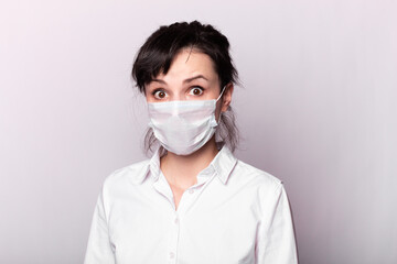 girl in a white shirt and medical mask