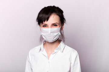 girl in a white shirt and medical mask
