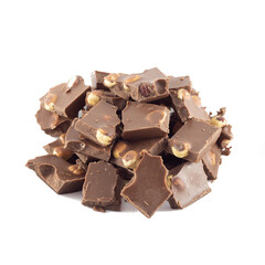 Pieces of milk chocolate with hazelnuts isolated on white background