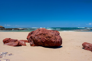Red rocks on Smith`s beach on Phillip island in Australia