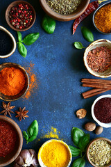 Assortment of natural organic spices in a bowls. Top view with copy space.