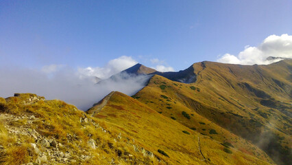 mountains and Mountain trail in the clouds © Lukasz Dziegel