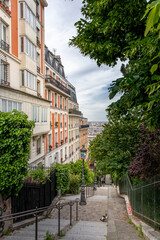 Paris, France - May 12, 2020: Typical stairs and Haussmann buildings in Montmartre in Paris