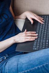 Close-up hand of a young woman working at remote work