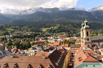 Obraz premium Aerial view of Innsbruck city taken from City Tower (Stadtturm) which was built in 1450 in Tirol, Austria. With 51 meters of height, City Tower is located in Old City (Altstadt or Altestadt).