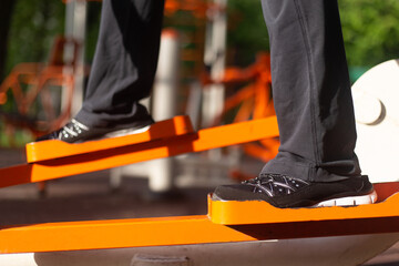 Exercising on the simulator for legs, running and walking, stepper