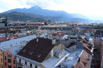 Fototapeta na wymiar Aerial view of Innsbruck city taken from City Tower (Stadtturm) which was built in 1450 in Tirol, Austria. With 51 meters of height, City Tower is located in Old City (Altstadt or Altestadt).