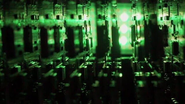 Lots of finished Electric boards in green light on background