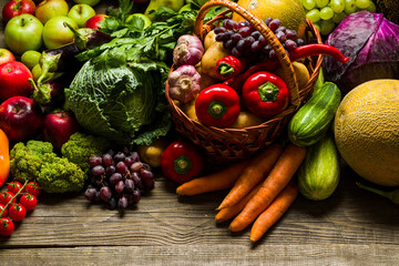 wicker grocery basket with agricultural vegetables from the grocery market, place for text