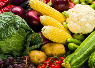 sweet corn and a variety of vegetables, zucchini cabbage potatoes, broccoli