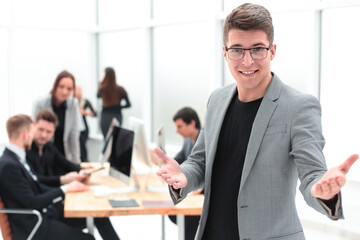 close up. friendly businessman inviting to his office