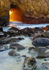 Sunset Through Portal of Keyhole Arch aka Pfeiffer Beach Arch at Pfeiffer Beach,Pfeiffer Big Sur State Park, Big Sur, California, USA