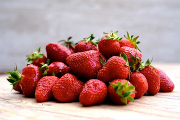 strawberry on top of a wooden table