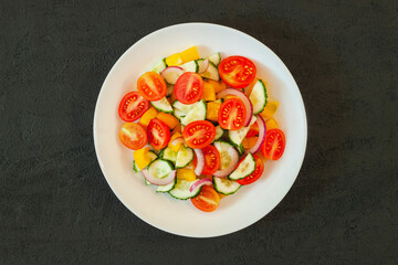 Green salad with tomato and fresh vegetables
