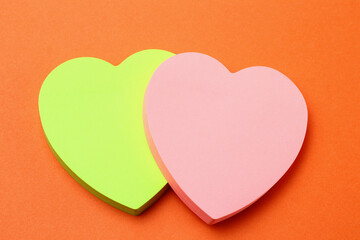 Two blank heart shaped stickers with space for text. Creative symbolic background