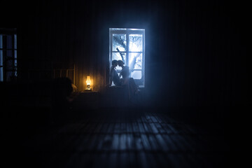 Beautiful passionate young couple lying on bed and having sex. Sensual man and woman making love in bedroom.