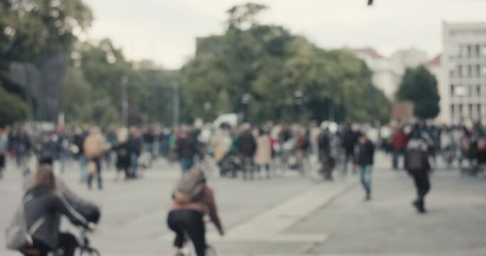 Demonstration on bicycles protest against government for protecting nature in Europe during pandemic unrecognizable blurry crowd gather on public square