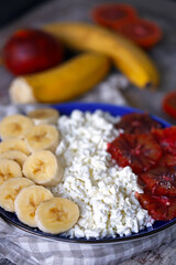 Selective focus. Plate with cottage cheese and fruits. Healthy breakfast, dessert or snack.