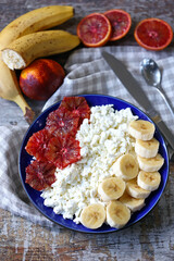 Selective focus. Plate with cottage cheese and fruits. Healthy breakfast, dessert or snack.