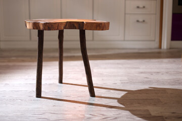 Old wooden coffee table with kitchen background