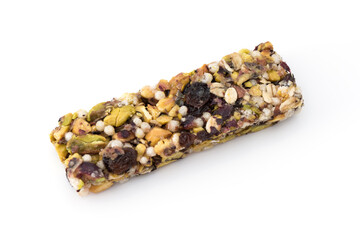 Fruit, nut and seed bar with pistachios isolated on white.