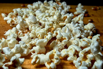 bunch of popcorn on black background