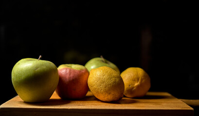 fruit in wood on black background
