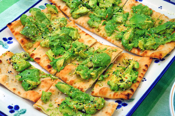 Flatbread avocado toast with Everything but the Bagel seasoning on top