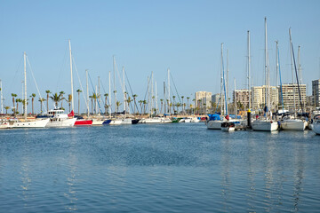 Obraz premium Las Palmas, Canary Islands / Spain - May 30 2020: Las Palmas de Gran Canaria City Marina - inactive sailing boats in the marina, results of Covid coronavirus lock down in Spain.