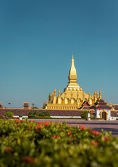 Golden Pagoda in Vientiane, Laos. Pha That Luang at Vientiane. Blue sky background beautiful.