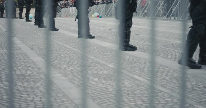 Police forces in riot gear guarding demonstrations fencing protest on bicycles against government and for protecting nature on main public square in Ljubljana Slovenia Europe during pandemic
