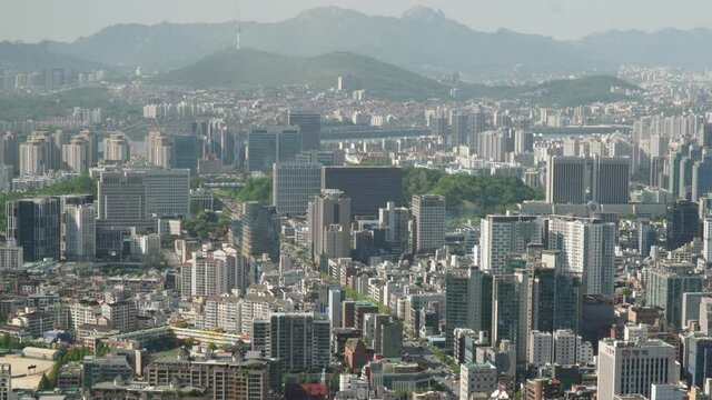 Flying out over Seoul city  day time, city overview, Namsan tower, Seocho district day time