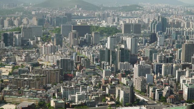 Pan left time laps over busy Seoul streets in Seocho district top view