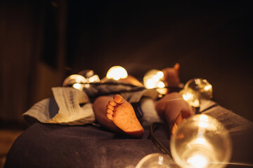 legs of the baby on a deck chair with backlight.