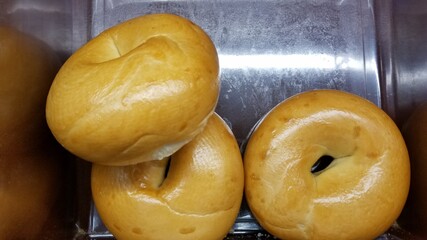 Close up of bagels for sale in bakery store