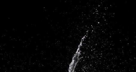 water bursting up from the bottom center of the frame.