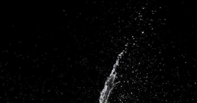 water bursting up from the bottom center of the frame.