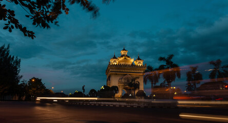 Fototapeta na wymiar Vientiane Laos, sunset city skyline at Patuxai (Patuxay). Monument, landmark, city, traffic, lighting.