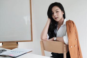 Obraz na płótnie Canvas Portrait Of Attractive Asian Businesswoman Working for marketing plan