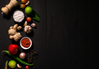 spices with ingredients on dark background. asian food, healthy or cooking concept.