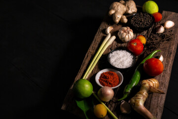spices with ingredients on dark background. asian food, healthy or cooking concept.