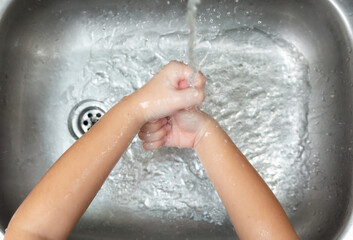 Coronavirus pandemic prevention wash hands with soap warm water and rubbing nails and fingers...