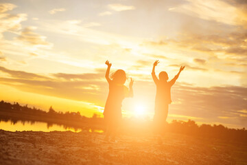 kid silhouette,Moments of the child's joy. On the Nature sunset