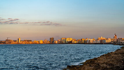 Sunset in Old Havana Cuba, with the street lights of El Malecon. Latin, cityscape.