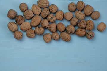 Walnut set  on a  blue wooden background.Organic Pure Bio Product. Useful Snack. Healthy fats