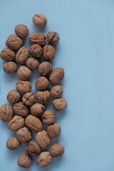 Walnut set  on a light blue wooden background.Organic  Bio Product. Useful Snack. Healthy fats