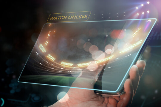 Watch it online Football field on the smartphone screen. - Powered by Adobe